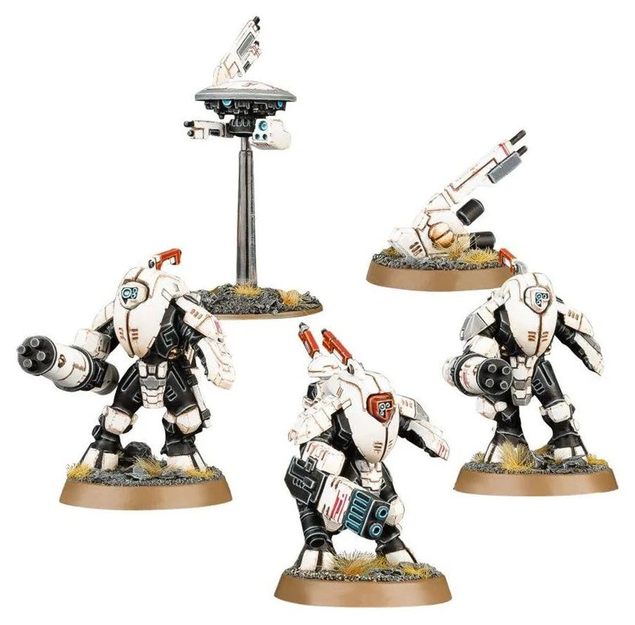 Three detailed robot figurines on stands with a white background